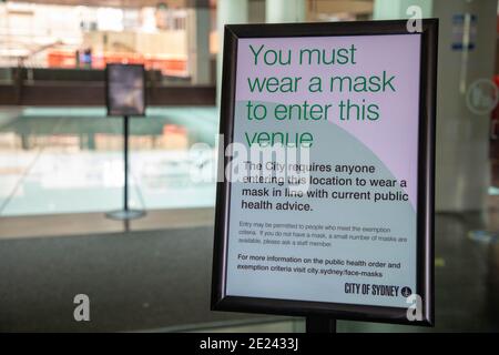 Sydney, Australia. 12th January 2021. City of Sydney sign at the entrance to Customs House library enforcing the wearing of masks during the coronavirus (Covid-19) pandemic. Credit: Richard Milnes/Alamy Live News Stock Photo