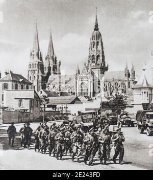 The entry of the English troops at Bayeux (in Normandy in northwestern France). In the background is the famous Cathedral, which fortunately did not s Stock Photo