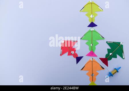 Miniature tiny kites with small spool of thread rolls, Patang with firki manjha for this uttarayan makar sankranti specil indian festival of kite flyi Stock Photo