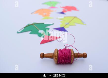 Miniature tiny kites with small spool of thread rolls, Patang with firki manjha for this uttarayan makar sankranti specil indian festival of kite flyi Stock Photo