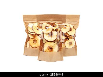 Apple chips in paper packages isolated on white background close up Stock Photo