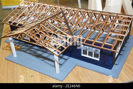 A modern house construction scale model, miniature architecture project  with a detailed wooden roofing construction, wooden framing a gable roof  Stock Photo - Alamy