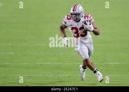 January 11, 2021: Ohio State Buckeyes running back MASTER TEAGUE III (33) runs the ball during the College Football Playoff National Championship at Hard Rock Stadium in Miami Gardens, Florida. Credit: Cory Knowlton/ZUMA Wire/Alamy Live News Stock Photo