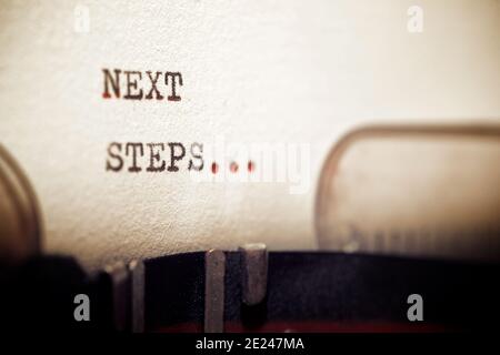 Next steps phrase written with a typewriter. Stock Photo