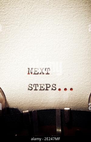 Next steps phrase written with a typewriter. Stock Photo