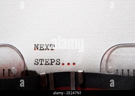 Next steps phrase written with a typewriter. Stock Photo