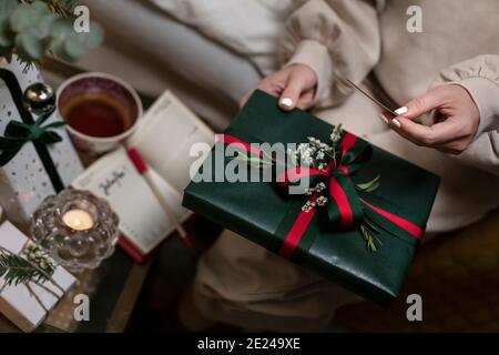Womans hands holding Christmas present Stock Photo