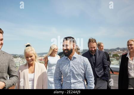 Coworkers talking on terrace Stock Photo