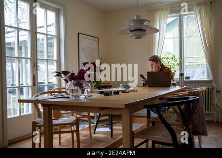 Man sitting at table Stock Photo