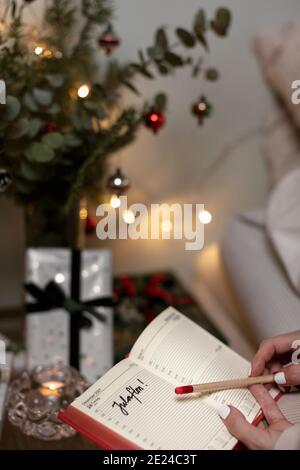 Womans hands holding diary Stock Photo