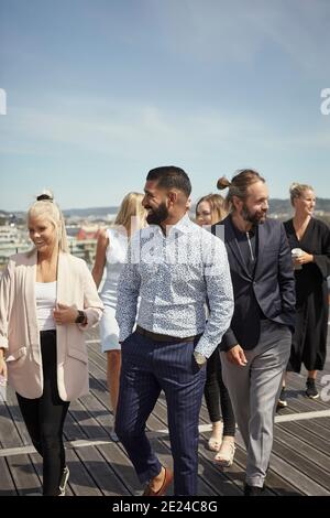 Coworkers talking on terrace Stock Photo