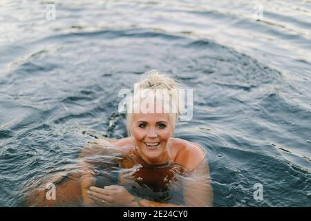 Woman swimming in sea Stock Photo