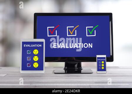 Evaluation concept shown on different information technology devices Stock Photo