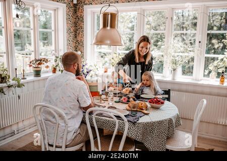 Family having meal together Stock Photo