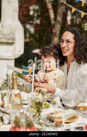 Family having meal in garden Stock Photo
