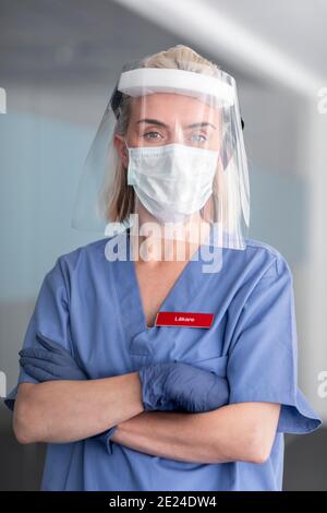 Female doctor wearing face shield Stock Photo