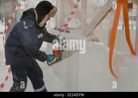 Workman assembler customize chainsaw ice plate Stock Photo