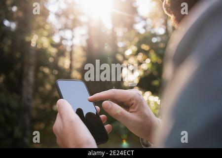 Close-up of hands using cell phone Stock Photo