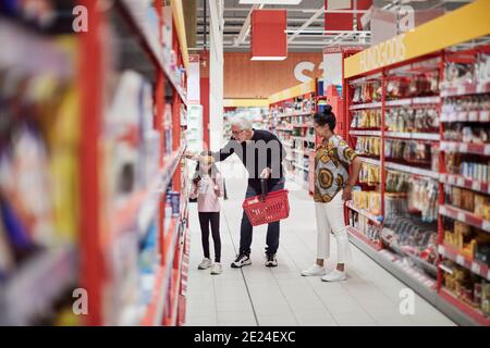 Family doing shopping in supermarket Stock Photo