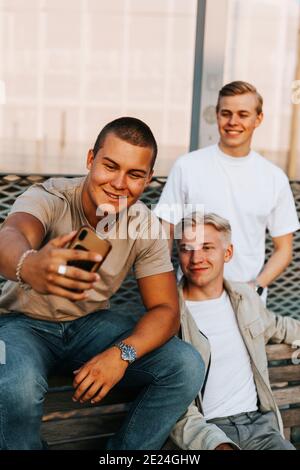 Male friends taking selfie Stock Photo