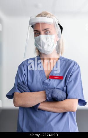 Female doctor wearing face shield Stock Photo