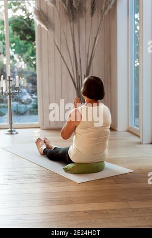 Women practicing yoga in class Stock Photo