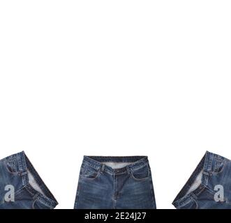 Front pockets, waist areas, zippers, and buttons of three pairs of dark blue jeans isolated on white background. Close up shot. Copy space above jeans Stock Photo