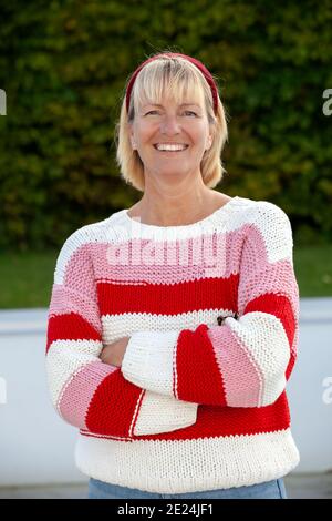 Smiling woman looking at camera Stock Photo