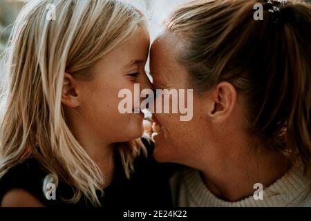 Happy mother and daughter together Stock Photo