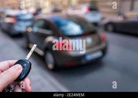 Hand holding car key Stock Photo