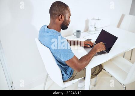 Hard-working man is typing on a keyboard Stock Photo