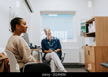 Woman in doctors office Stock Photo