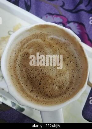 A coffee cup is a container that coffee and espresso-based drinks are served in. Coffee cups are typically made of glazed ceramic Stock Photo