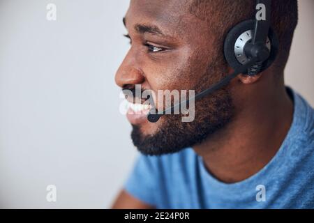 Headphones with microphone on a man head Stock Photo