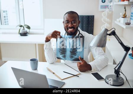 Medical professional being positive about x-ray results Stock Photo