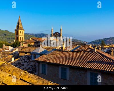 Early morning view across rooftops towards Esglesia de Sant Bartomeu a church in Soller in north west Mallorca Balearic Islands Spain Stock Photo