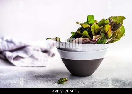 Beetroot leaves in ceramic bowls Stock Photo