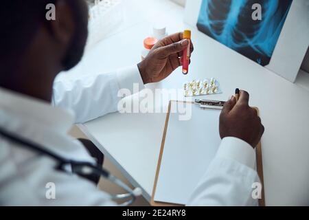 Doctor is taking a vaccine test tube Stock Photo