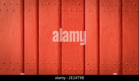 Red painted wooden exterior door. Stock Photo