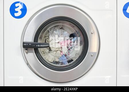 White Washing Machine At laundry front view Stock Photo