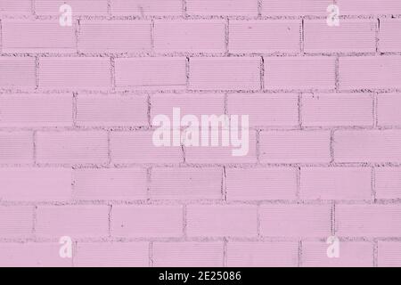 Pink colored old brickwall background Stock Photo