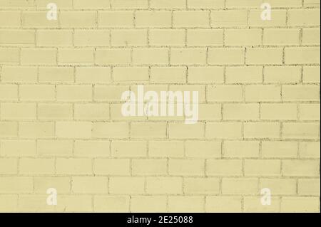 Yellow painted bricks wall background Stock Photo