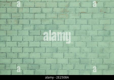 Old green painted brickwall background Stock Photo