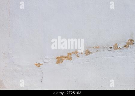 Old white wall with peeling paint Stock Photo