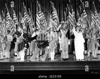 JEANNE CAGNEY JAMES CAGNEY as George M. Cohan JOAN LESLIE WALTER HUSTON and ROSEMARY DeCAMP performing You're a Grand Old Flag number in YANKEE DOODLE DANDY 1942 director MICHAEL CURTIZ Warner Bros. Stock Photo