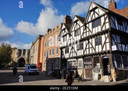 The tudor-style building with the castle entrance at the top of the steep hill Stock Photo