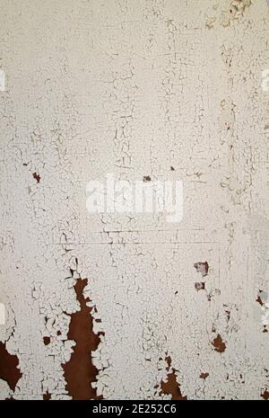 Old white wall with peeling paint, grunge texture or background Stock Photo