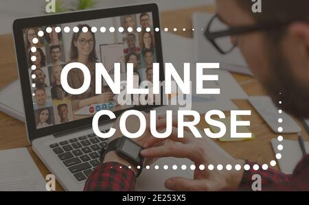 Young casual businessman in office, attending online course Stock Photo