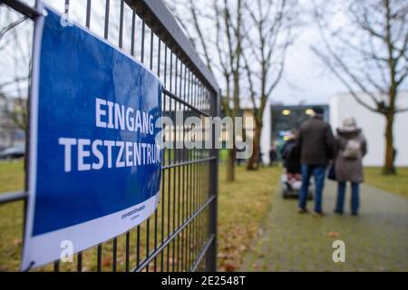 Magdeburg, Germany. 12th Jan, 2021. 'Entrance Test Center' is written on a sign. Employees of Magdeburg University Hospital are currently using a spit-saliva test there in parallel to a conventional antigen test. The tests are free of charge and aim to further validate the spit test. It is produced by the Serumwerk in Bernburg and has been approved in Germany with a 94 percent sensitivity. It provides a result after 10 minutes. If a person tests positive, a PCR test follows to further validate the result. Credit: Klaus-Dietmar Gabbert/dpa-Zentralbild/dpa/Alamy Live News Stock Photo