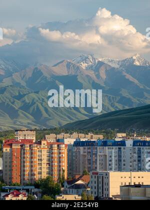 Cityview with modern high rise buildings,  background the mountains of Alatau and Ala Artscha National Park The capital Bishkek located in the foothil Stock Photo
